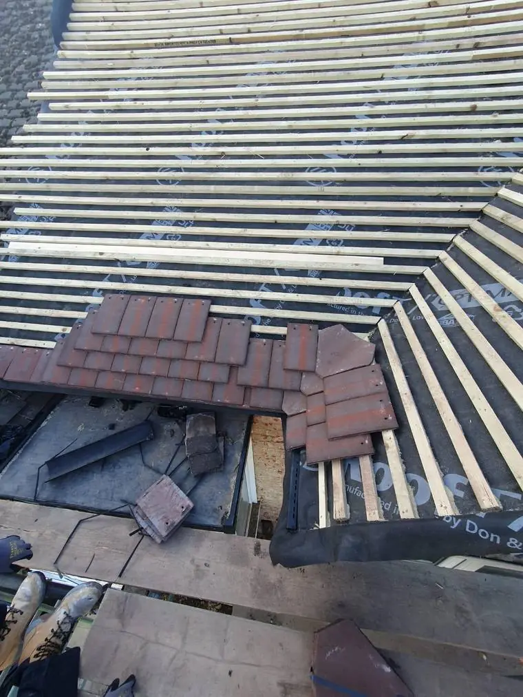 Tiles loaded out across new battens on a re-roof