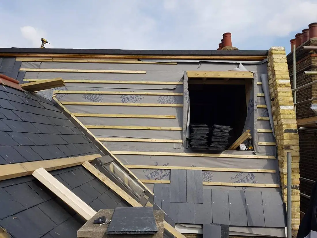 Re-slating around a dormer on new membrane and battens