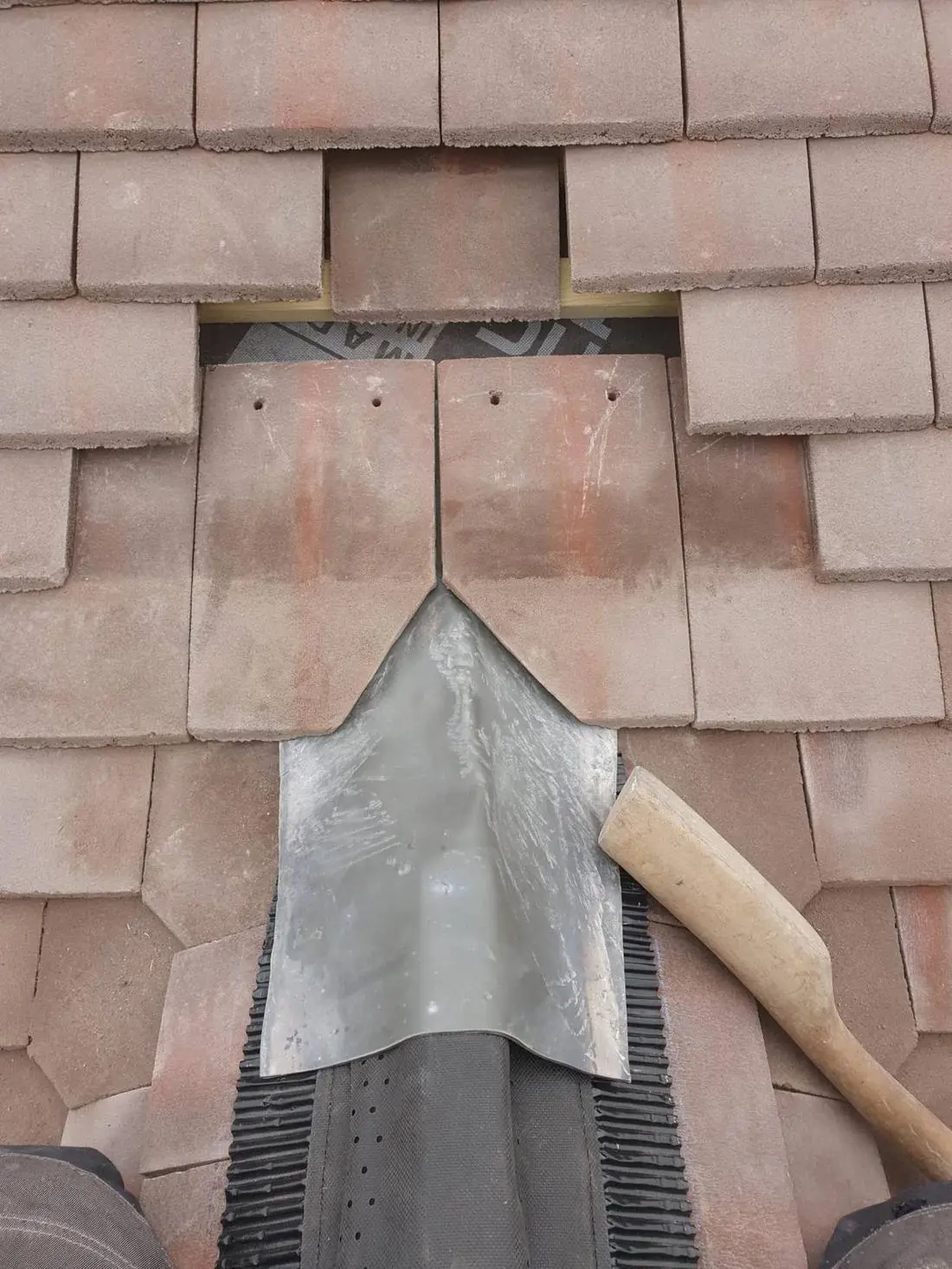 Lead soakers stepped into plain tiles